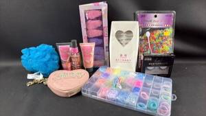 lot 80 image: Juicy Couture Heart Shaped Wristlet, Glamour and Beauty Bundle