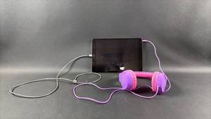 lot 236 image: iPad and Earphones (Charges and Powers Up-LOCKED)