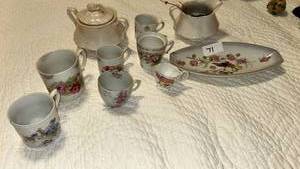 lot 70 image: Porcelain Tea Set with Floral Decoration Multiple Cups Saucers Teapot Serving Pieces