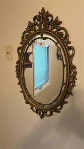 lot 84 image: Ornate Oval Wall Mirror with Decorative Frame
