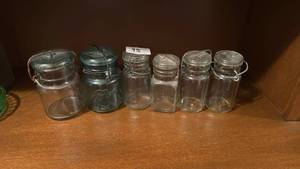 lot 95 image: 6 Glass Jars with Lids and Handles Mixed Styles