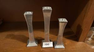 lot 100 image: Three Metal Candlestick Holders with Square Bases and Circular Tops