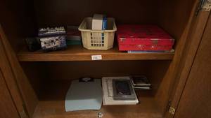 lot 112 image: Mixed Shelf Lot Garmin Box, HP Photo Paper, Decorative Tins, Books, Scale, Cards