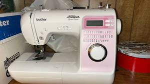 lot 216 image: Brother Innov-is 40 Project Runway Limited Edition Sewing Machine With Very nice Sewing cabinet as shown in pictures