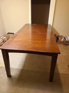 lot 905 image: Dining table 30x82x42 , which includes a 20 inch leaf, located in basement