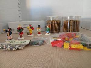 lot 1194 image: The Original Snow Village Christmas Kids Figurines Accessories with twig Snow Fence garland lights and Legos