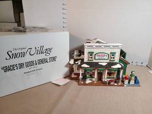 lot 1306 image: The Original Snow Village Gracies Dry Goods & General Store Set of 2 Handpainted Ceramic
