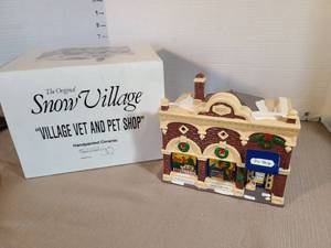 lot 1321 image: The Original Snow Village Village Vet and Pet Shop Handpainted Ceramic 1992