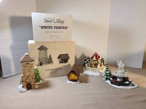 lot 2132 image: Department 56 Snow Village Winter Fountain and Heritage Village Ceramic Accessory Set