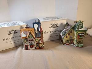 lot 2144 image: Heritage Village Collection North Pole Series  The Glacier Gazette and Tassys Mittens and Woolies