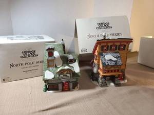 lot 2146 image: Heritage Village Collection North Pole Series 2 Porcelain Buildings Santas Bell Repair and Elves trade scool