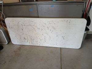 lot 3428 image: Lifetime Folding Table 6ft with surface stains, in garage