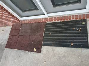 lot 4007 image: Rubber Floor Tiles 16x16 , 6, and black outdoor mat 36x24 outside in back yard
