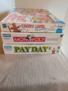 lot 7003 image: Board games, Candyland, Monopoly, Payday.