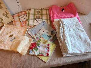 lot 7009 image: Vintage hankies plus laundry bags.