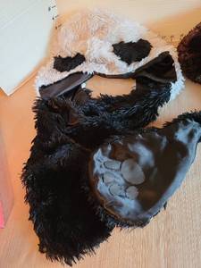 lot 7011 image: Panda winter hat with attached paw mittens and a scarf and gloves set