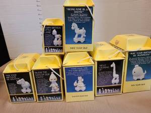 lot 7106 image: Precious Moments Birthday Series figures, by Enesco