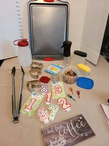 lot 7125 image: Cookie sheet with silicone handles, Tupperware spice shakers, birthday candles, more