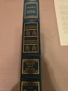 lot 7143 image: Travels by Michael Crichton Signed First Edition Franklin Library, mint condition