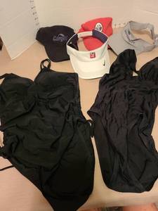 lot 7148 image: 2 Ladies black one piece swimsuits, size L, plus 4 hats