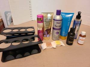 lot 7179 image: Lotions, soaps, hair care products, black plastic organizers