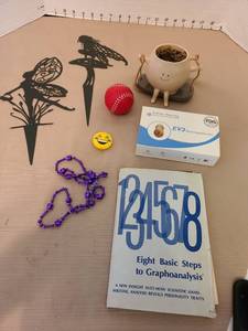 lot 7182 image: Audien EV3 rechargeable CIC hearing aid in box, metal fairy decor, more