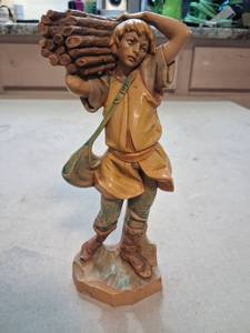 lot 36 image: Carved Figurine Boy Carrying Wood Logs