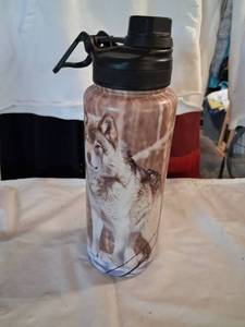 lot 142 image: Water Bottle with Wolf Graphic and Black Flip-Top Lid Approximately 32 oz