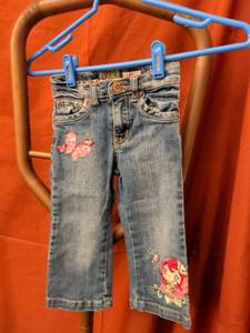 lot 34 image: Childrens Denim Jeans with Embroidered Butterfly and Character Design