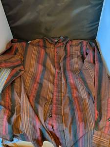 lot 165 image: Two mens dress shirts. One Ralph Lauren size extra large the other puritan extra large