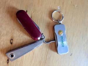 lot 180 image: Posco Multi-Tool Keychain Set with Red Handle and Blue Case