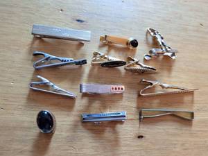 lot 181 image: Lot of 13 Metal Tie Clips and Cufflinks with Onyx Stone