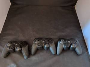 lot 258 image: 3 Game Controllers with Textured Grips D-Pad Dual Analog Sticks