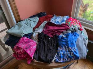 lot 291 image: Womans bundle of clothes. Assorted sizes large extra large size 6. Size medium size 18 shirts shorts pants pajama pants