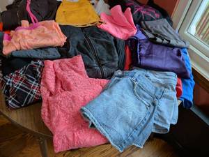 lot 307 image: Sorted lot bundle of clothes for women, assorted sizes, shorts, shirts, jackets, hoodies, leggings, etc