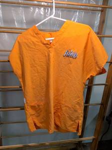 lot 48 image: Faith in Home Services LLC Orange Scrubs Shirt Medium