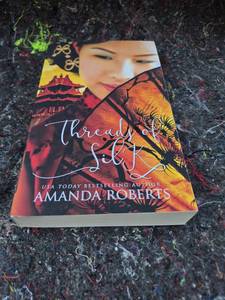 lot 16 image: Threads of Silk by Amanda Roberts Paperback Book