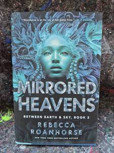 lot 28 image: Mirrored Heavens Between Earth & Sky Book 3 Rebecca Roanhorse