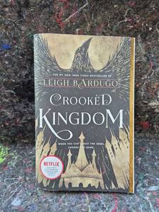 lot 98 image: Crooked Kingdom by Leigh Bardugo Paperback Book