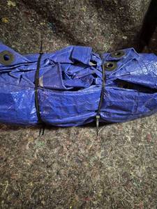 lot 20 image: Blue Tarp with Grommets and Bungee Cords