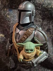 lot 61 image: Star Wars The Mandalorian Action Figure with Child Character