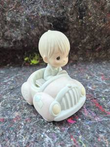 lot 527 image: Precious Moments Child in Car Figurine Following Jesus