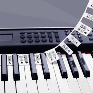 lot 10107 image: Piano Keyboard Stickers, Removable Silicone Note Labels for 61 Keys, Black
