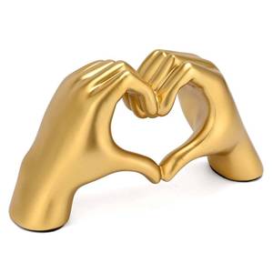 lot 1533 image: Boobezeen Heart Hands Sculpture Gold Resin
