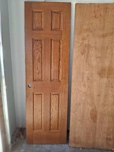 lot 1081 image: 6-Panel Solid Interior Door 24 x 80 inches and Hollow Unfinished Door