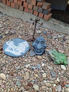 lot 1096 image: Garden Decor Lot - 4 Pieces - Weathervane, Face, Frog, Stone