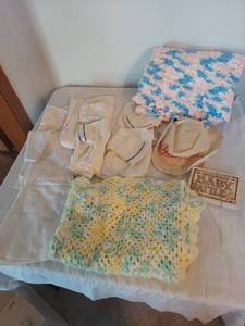 lot 1217 image: Baby Lot - Rattle with Blankets and Clothes