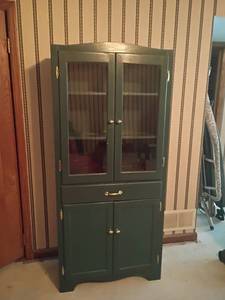 lot 905 image: Blueish Green Cabinet with Glass Doors, Drawer and Bottom Storage 67 x 30 x 13.  Located in basement