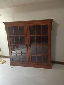 lot 913 image: Bookshelf with Glass Doors   61 x 61 x 14.   Located in basement