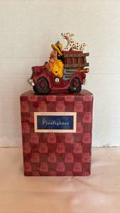 lot 1008 image: David Frykman The Firefighter Portfolio Figurine Red Fire Truck Dalmatian